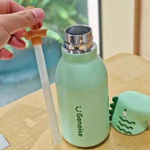Stainless steel dinosaur insulated water bottle detail view, cute green straw cup for students.