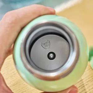Close up view of the stainless steel inner cup showing safe food grade material details.