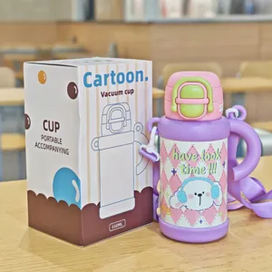 Kids 316 stainless steel vacuum insulated water bottle with strap, cute cartoon design.