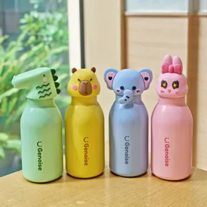 Detail view of cute cartoon animal insulated water bottles featuring dinosaur and bunny designs.