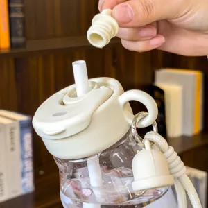 Portable plastic straw water bottle detail, cute design with secure lid and silicone plug.