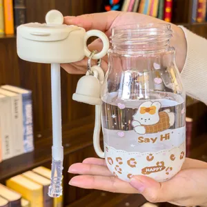 Transparent portable straw water bottle detail with cute rabbit and leopard print design.