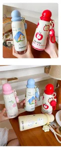 Cute stainless steel thermos water bottle with round lid, portable cartoon student cup.