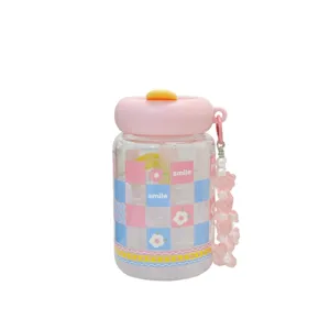 Cute pink checkered glass water bottle with straw and charming bead strap for daily use