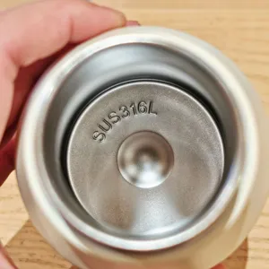 Stainless steel thermos cup inner view showing 316L quality material for daily portable drinks.