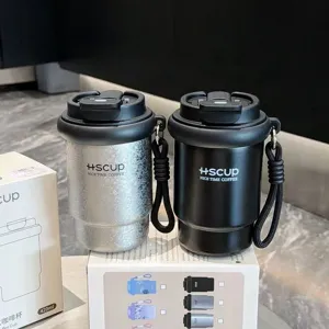 Portable stainless steel travel coffee vacuum insulated cup with straw and dual-drink lid.
