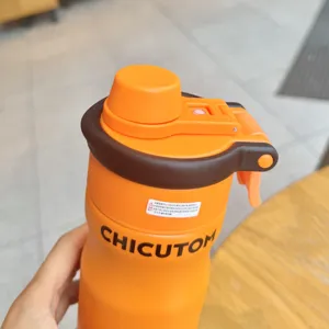 Portable stainless steel insulated sports water bottle with straw, orange and brown outdoor cup.