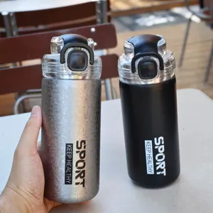 Stainless steel vacuum insulated sport water bottle with portable lid and stylish texture.