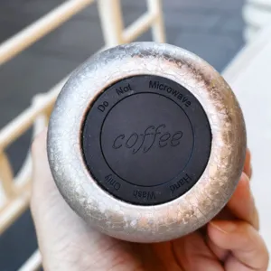 Stainless steel vacuum insulated water bottle bottom detail view, durable and stylish design.