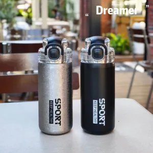 Stainless steel vacuum insulated sports water bottle with straw lid for outdoor use.