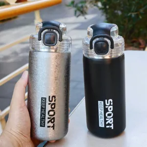 Stainless steel vacuum insulated water bottle with straw for sports and outdoor fitness activities.