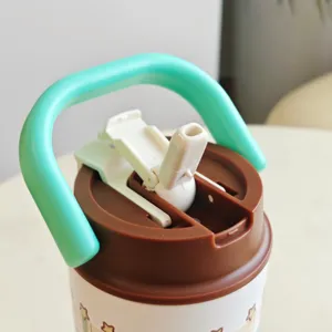Close-up detail of the portable insulated water bottle lid with a cute handle and straw design.