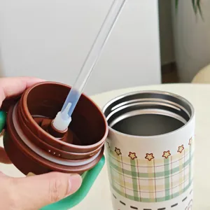 Stainless steel thermos straw cup detail view, cute plaid pattern with portable handle design.
