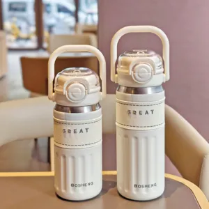Stainless steel vacuum insulated water bottle with portable handle and leather sleeve.