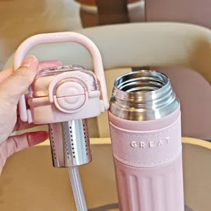 Close-up shot of the pink stainless steel vacuum water bottle lid with a tea infuser.
