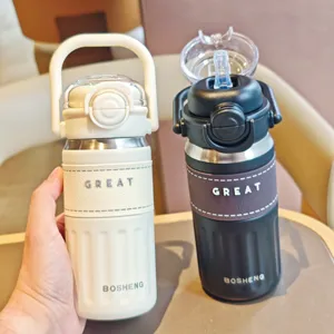 Detailed view of the stainless steel insulated water bottle with straw and portable handle.