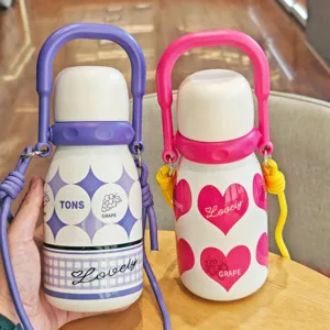 Portable stainless steel vacuum water bottle with handle and cute grape heart patterns.