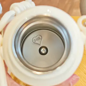 Detail view of the 316 stainless steel inner lining inside the portable vacuum thermos cup.