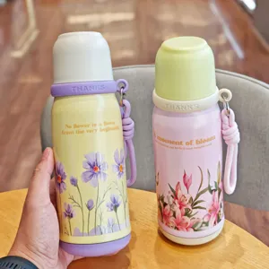 Portable floral stainless steel vacuum insulated water bottle with dual-use lid and handy strap