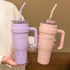Large capacity stainless steel tumbler with handle and straw for daily use and travel.