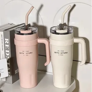 Large capacity stainless steel tumbler with handle and straw for travel and daily use.