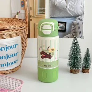 Grüne Edelstahl Vakuum Isolierflasche mit süßem Cartoon Hund Design und tragbarem Seil.