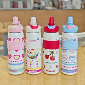 Close-up detail of four colourful stainless steel insulated water bottles with cute designs.