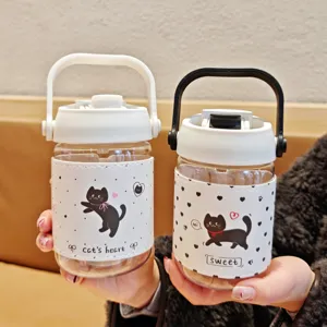 Close-up of portable plastic water cup detail with cute black cat print and leather sleeve.