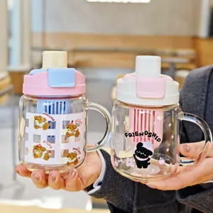 Detailed shot of cute high borosilicate glass water cup with handle and tea infuser.