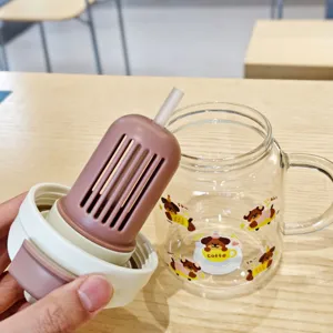 Heat-resistant glass water bottle with straw, cute cartoon dog design for daily use.