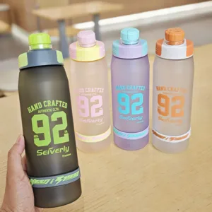 Detailed view of large capacity frosted plastic sports water bottle featuring vibrant colors.
