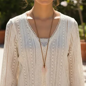 Bohemian style pink crystal pendant long necklace detail, featuring a suede cord design.