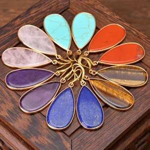 Natural stone teardrop gold plated earrings detail view showing various gemstone colors.