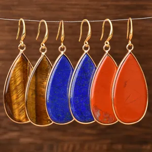 Natural stone teardrop earrings with gold-plated rims, showcasing detailed gemstone texture.
