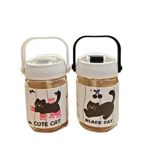 Cute cat glass water bottle with portable handle and protective sleeve for outdoor travel.