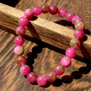Detail view of colorful natural stone beaded bracelet with elastic string for women daily wear.