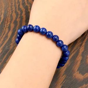 Natural blue gemstone beaded stretch bracelet for women elegant wrist jewelry piece.