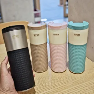 Stylish stainless steel coffee mug with silicone sleeve and secure lid for daily use.