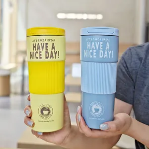 Stainless steel coffee cup with silicone sleeve, vacuum insulated thermal travel tumbler.
