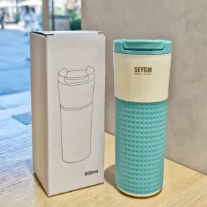 Stylish stainless steel coffee cup with silicone sleeve, 500ml vacuum insulated travel mug for daily use.