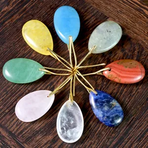Vibrant natural stone teardrop earrings set with gold hooks, elegant European style jewelry.