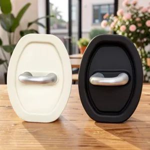 Car door lock cover protectors, oval silicone buffer dampening pads in white and black.