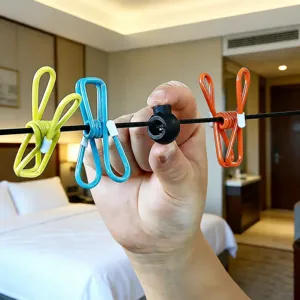 Portable travel clothesline with adjustable anti-slip buckle and colorful clips for outdoor drying.