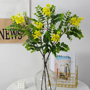 Branche de fleurs de cassia jaunes artificielles feuillage vert pour deco maison