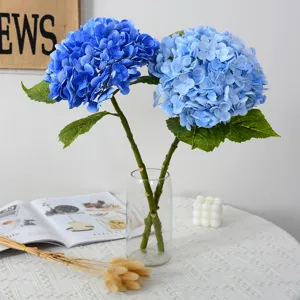 Artificial blue hydrangea flowers bouquet in glass vase for home wedding table decor