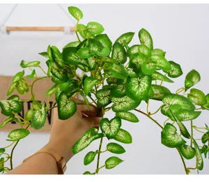 Artificial hanging vine plant fake green leaves wall decor for living room indoor home display.