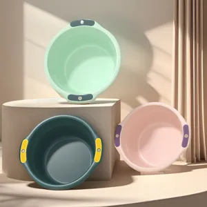 Plastic washbasin detail showing double handles, colorful design for home or dorm use.