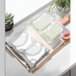 Frosted waterproof travel storage bag for clothes, underwear, and luggage organization.