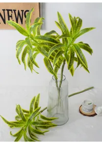 Artificial lily bamboo plant for home decor, vibrant green faux foliage in glass vase.