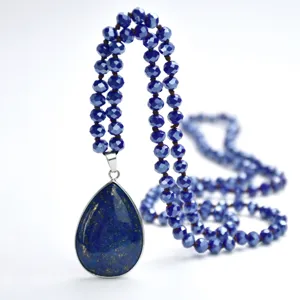 Bohemian long crystal beaded sweater chain with a stunning teardrop blue stone pendant for women.